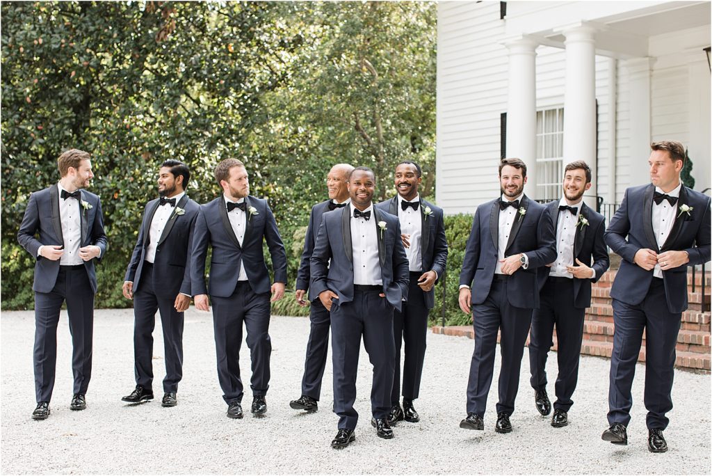 Groomsmen in front of the entrance of the Primrose Cottage