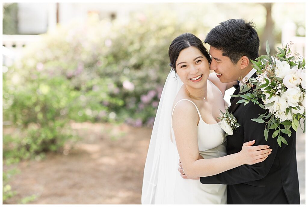 bride and groom in front of the primrose cottage wedding venue
